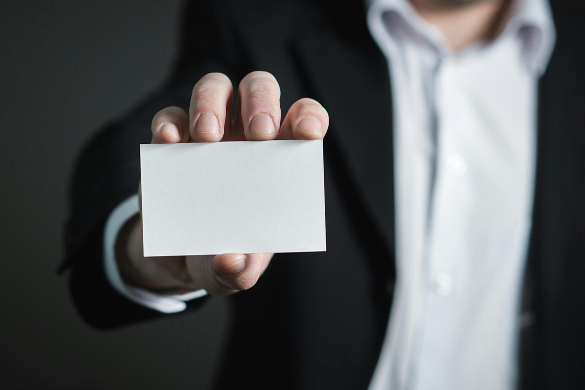 Man holding empty business card