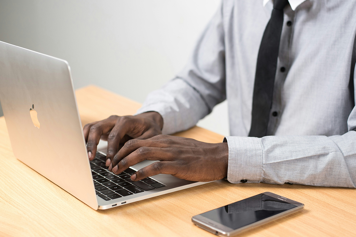 Man typing on a laptop